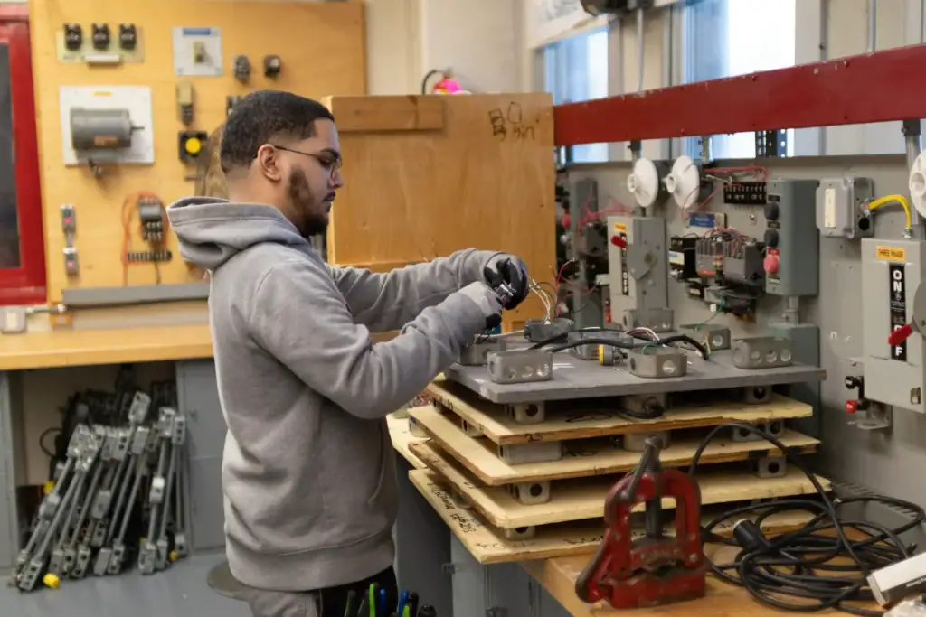 Student works on configuring wires. 
